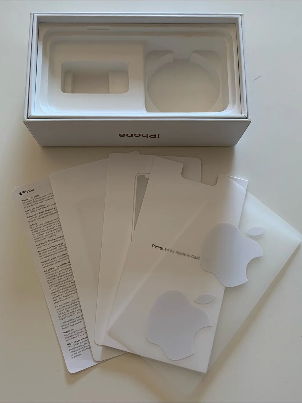 Empty iPhone Xs Gold Box and Apple Stickers